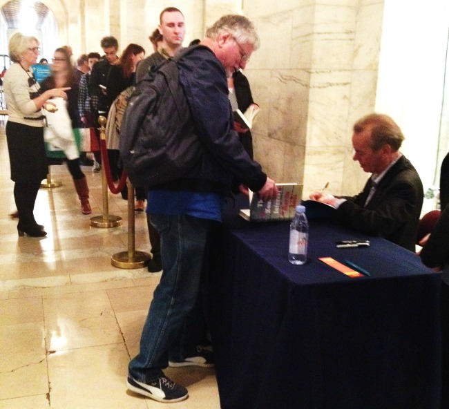 Author-Martin-Amis-signing-book-The-Zone-of-Interest 650x592
