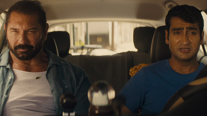 Stuber the movie lead characters Dave Bautista and Kumail Nanjiani in Uber vehicle photo courtesy of Walt Disney 710x400