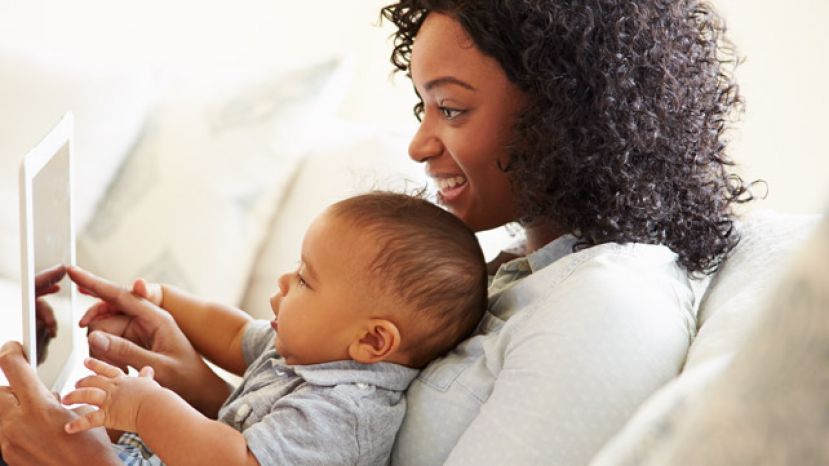 Toddler and mom playing with a mobile device