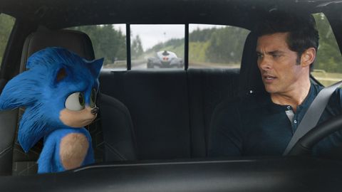 Actor James Marsden driving a car talking with the Hedgehog, who is a passenger in the vehicle. 