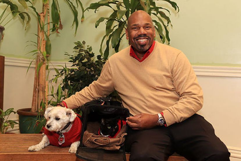 Hartford J. Hough with is Maltese Terrier, Ginger, and his cat