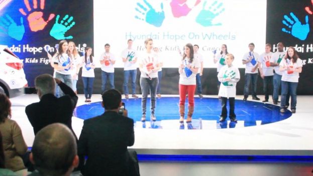 Young people in the fight to prevent and eliminate childhood cancer at the Hyundai Hope on Wheels exhibit at the 2013 New York International Auto Show