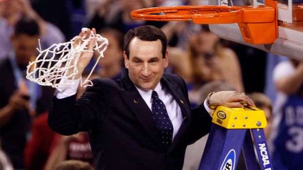 Duke University's Men's Head Basketball Coach Mike Krzyzewski obtaining a basketball net after securing 1,000 wins as a college head basketball coach