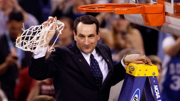 Duke University&#039;s Men&#039;s Head Basketball Coach Mike Krzyzewski obtaining a basketball net after securing 1,000 wins as a college head basketball coach